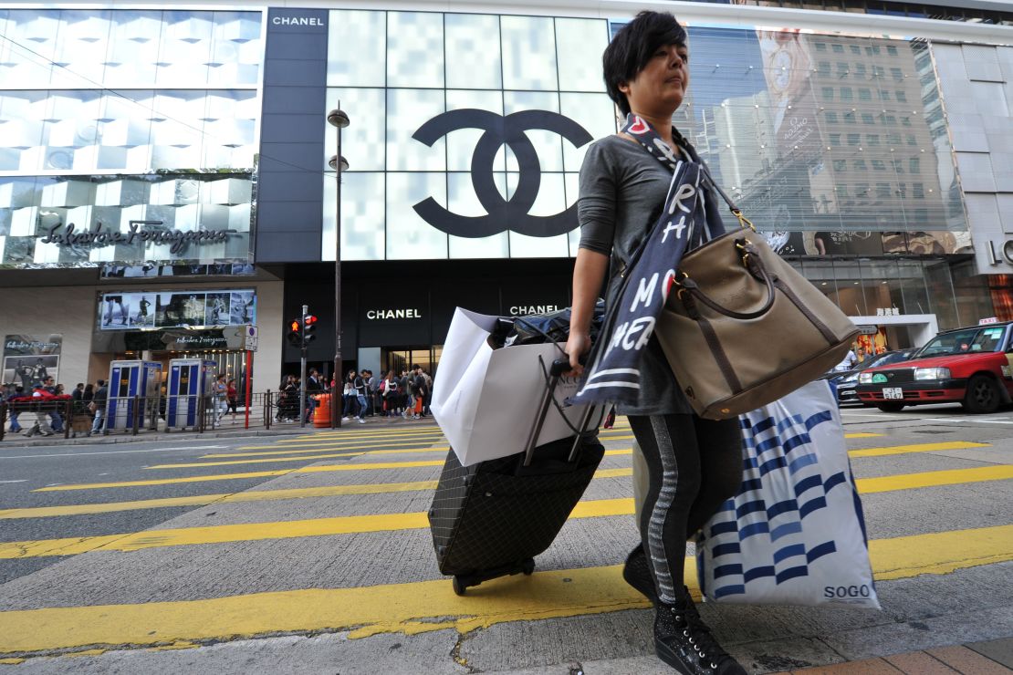 Shoppers scoop up designer goods in Tsim Sha Tsui.