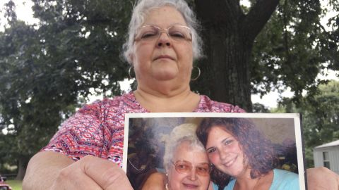 Susan Bro, the mother of Heather Heyer, holds a photo of Bro's mother and her daughter, Monday, Aug. 14, 2017, in Charlottesville, Va. Heyer was killed Saturday, Aug. 12, 2017, when police say a man plowed his car into a group of demonstrators protesting the white nationalist rally. Bro said that she is going to bare her soul to fight for the cause that her daughter died for.