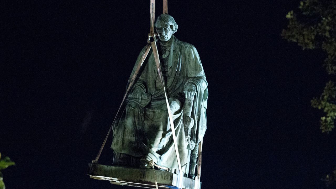 A monument of Chief Justice Roger B. Taney is removed early Friday at the Maryland State House.