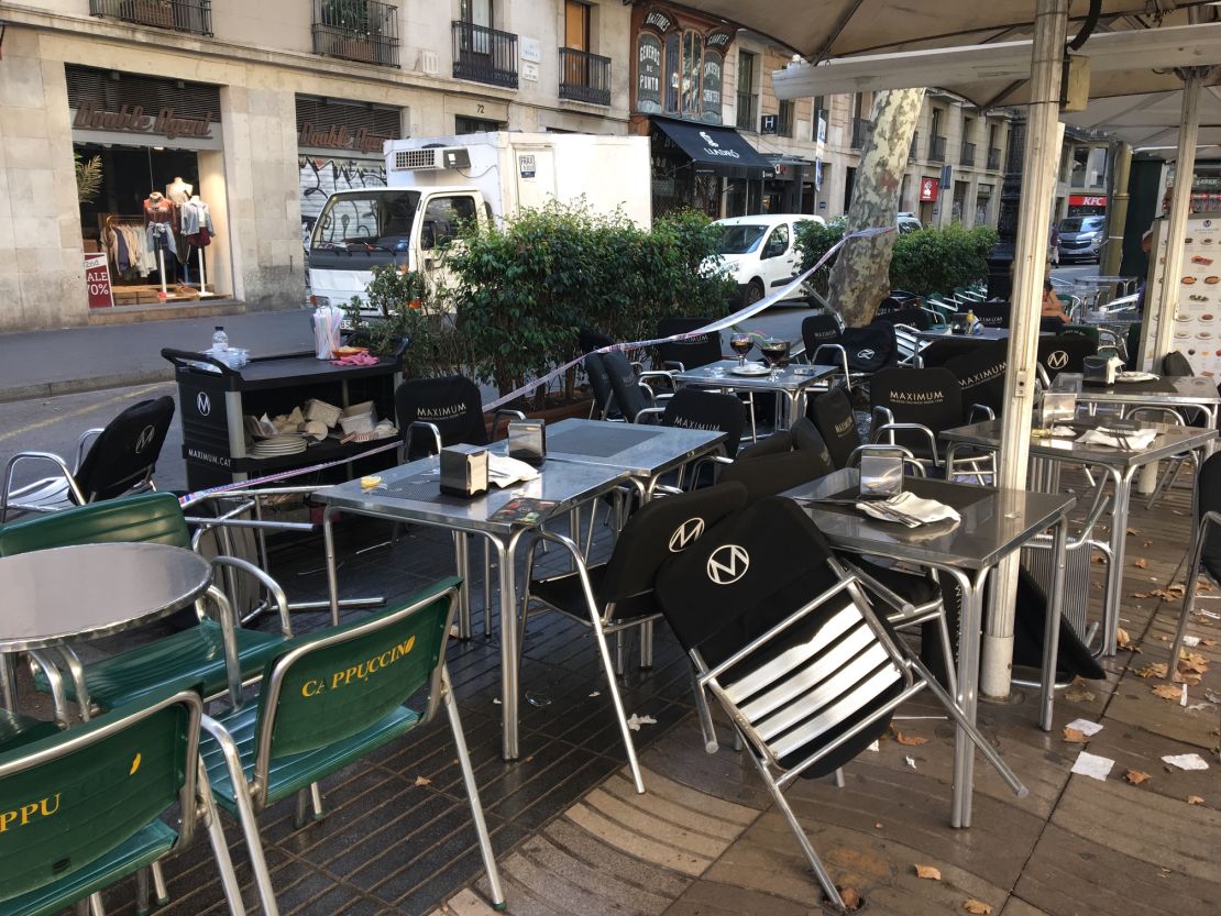 Tables and chairs at pavement cafes on Las Ramblas offer hints to the chaos that erupted here, prompting visitors enjoying an early evening drink to scatter in panic.