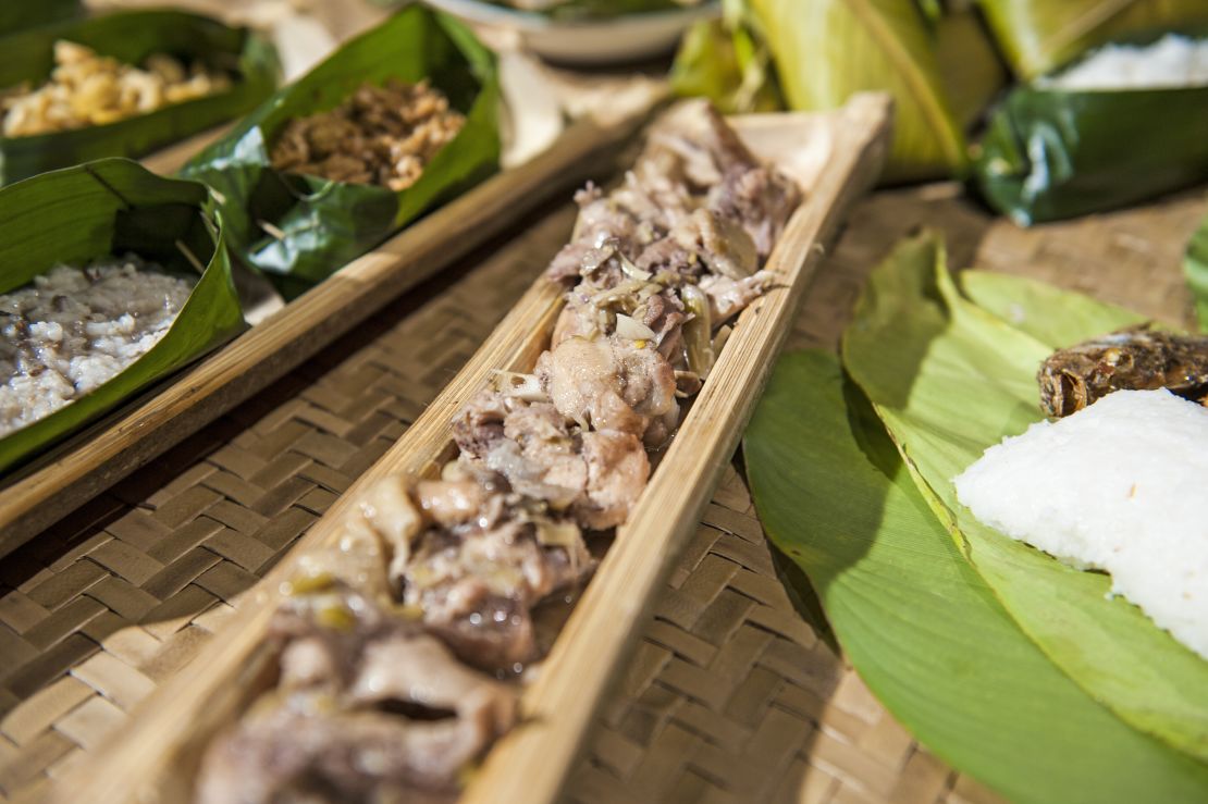 Manok pansoh is cooked inside a long piece of bamboo.