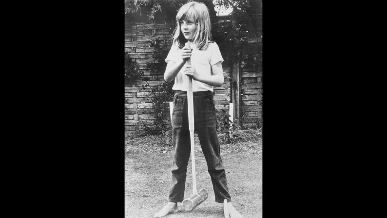 A barefoot Diana poses with a croquet mallet while on holiday in Itchenor, West Sussex, in the summer of 1970. 