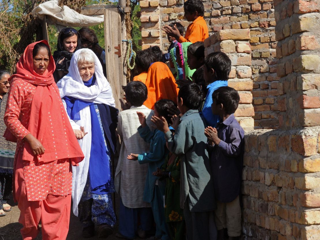 Ruth Pfau is welcomed by brick kiln laborers in Karachi in 2010.