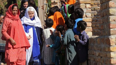 Ruth Pfau is welcomed by brick kiln laborers in Karachi in 2010.