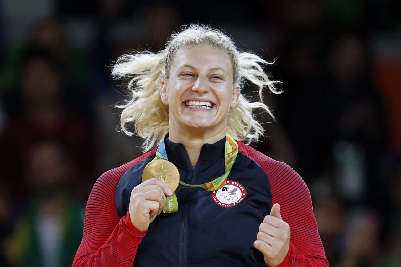 Kayla Harrison celebrates successfully defending her Olympic gold medal at last year's Rio Olympics. 