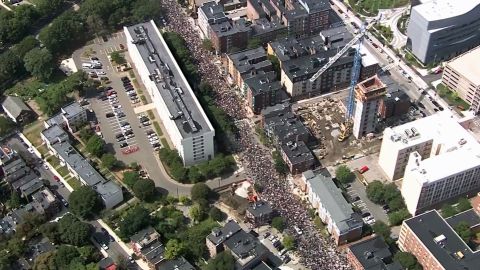 Throngs march before the start of Saturday's rally in downtown Boston.