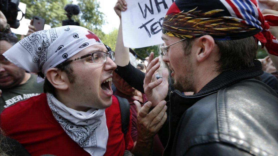 A counterprotester, left, confronts a professed Trump supporter Saturday on Boston Common.