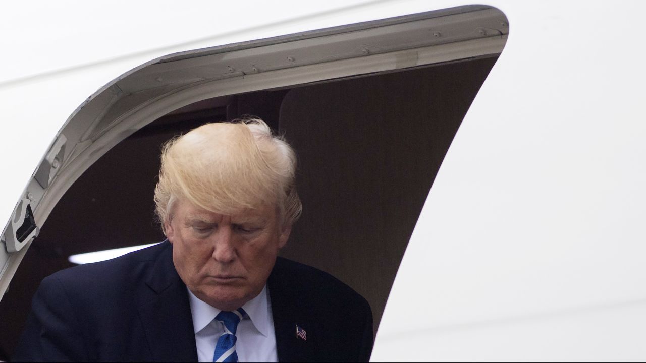 US President Donald Trump disembarks from Air Force One upon arrival at Morristown Municipal Airport in Morristown, New Jersey, on August 18, 2017, following travel for meetings at Camp David in Maryland, as he returns to Bedminster, New Jersey to continue his vacation. 