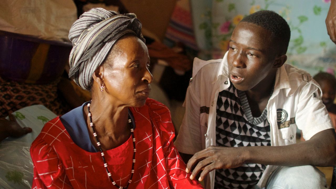 Hawa Marah and her grandson. She lost three of her five children, and her home in the disaster and doesn't know where she and her family will live going forward.