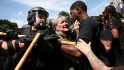 Protesters face off with riot police escorting conservative activists following a march in Boston against a planned 'Free Speech Rally' just one week after the violent 'Unite the Right' rally in Virginia left one woman dead and dozens more injured on August 19, 2017 in Boston, United States. Although the rally organizers stress that they are not associated with any alt-right or white supremacist groups, the city of Boston and Police Commissioner William Evans are preparing for possible confrontations at the afternoon rally.