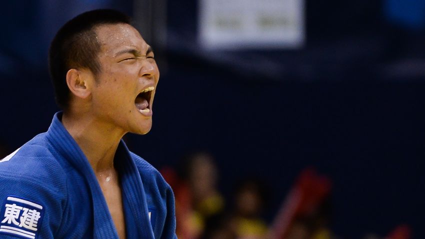 RIO DE JANEIRO, BRAZIL - AUGUST 27: Masashi Ebinuma of Japan celebrates the victory and the gold medal in the -66 kg final category during the World Judo Championships at the Maracanazinho gymnasium on August 27, 2013 in Rio de Janeiro, Brazil. (Photo by Buda Mendes/Getty Images)