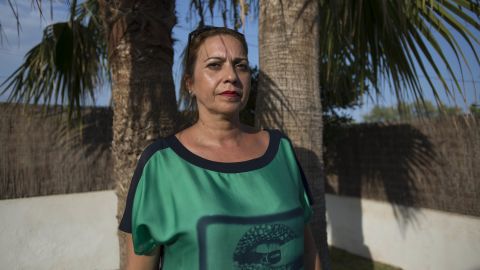 Gil, standing under a palm tree in her front yard, says she can't imagine why the suspects chose her neighborhood as their home base.