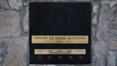 A recording at Memorial Hall at Stone Mountain Park is geared toward international visitors.