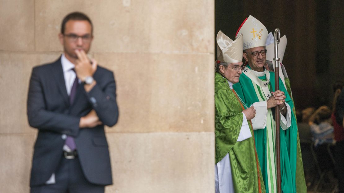 Cardinal Lluís Martínez Sistach, center, speaks with Archbishop of Barcelona, Cardinal Joan Josep Omella, while awaiting King Felipe and Queen Letizia's arrival.