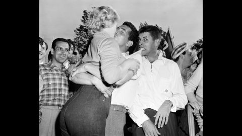 Martin, center, kisses actress Denise Darcel, as Lewis feigns irritation. The pair were at a golf event in 1953 in Eastchester, New York. 