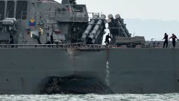 The guided-missile destroyer USS John S. McCain is seen with a hole on its portside after a collision with an oil tanker outside Changi naval base in Singapore on August 21, 2017.
Ten US sailors were missing and five injured after their destroyer collided with a tanker east of Singapore early on August 21, the second accident involving an American warship in two months. / AFP PHOTO / Roslan RAHMAN        (Photo credit should read ROSLAN RAHMAN/AFP/Getty Images)