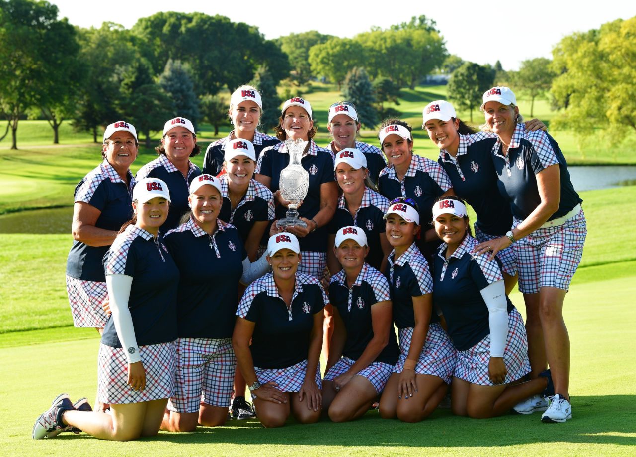 Team USA pose with the Solheim Cup after comfortably defeating Team Europe by 16.5 to 11.5.