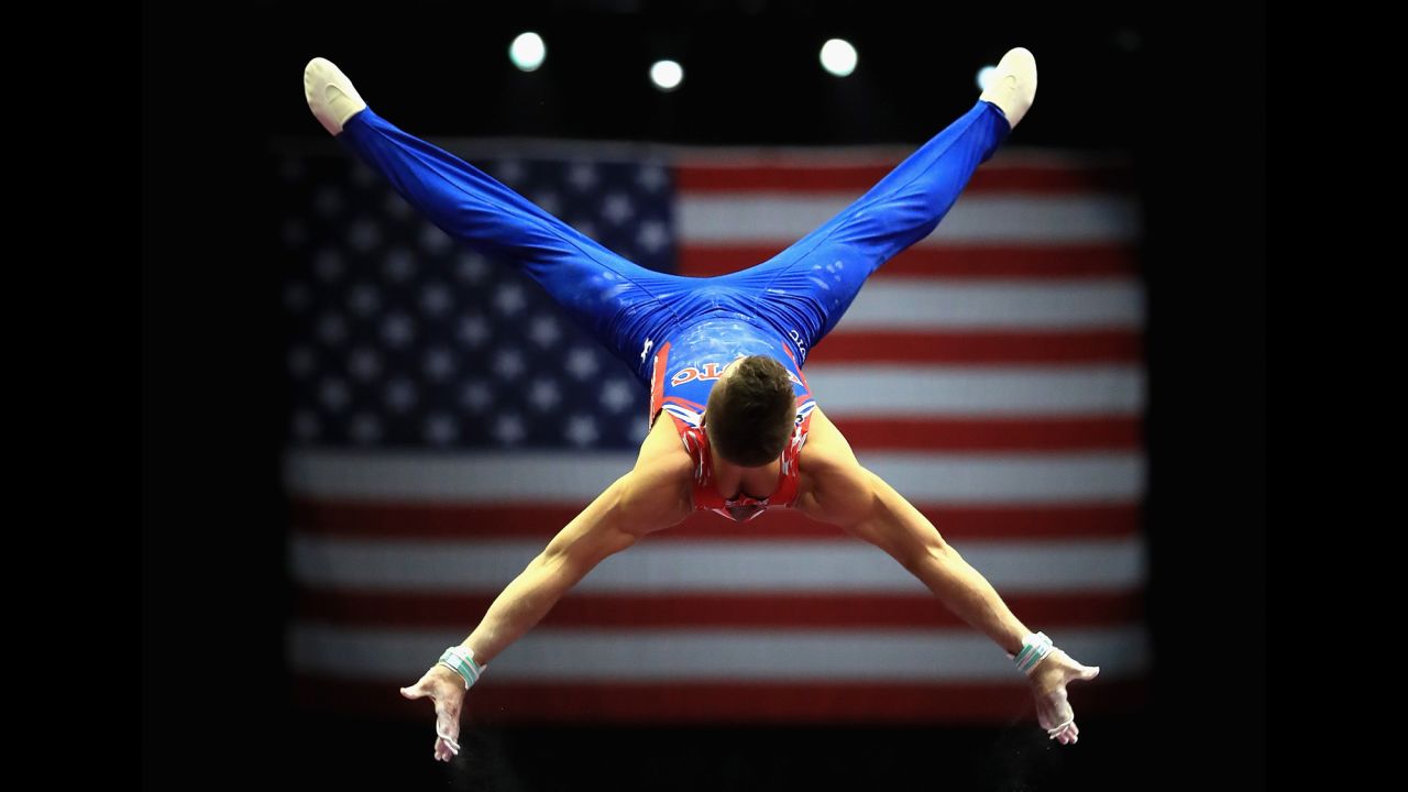 Sam Mikulak competes on the high bar Thursday, August 17, during the P&G Gymnastics Championships in Anaheim, California. He finished the event in third place.