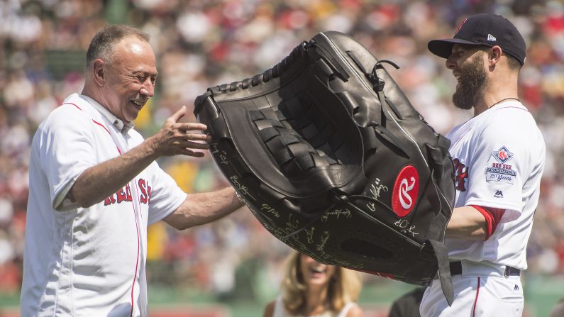 Boston second baseman Dustin Pedroia presents NESN broadcaster Jerry Remy with a giant glove during a pregame ceremony on Sunday, August 20. Remy, <a href="index.php?page=&url=http%3A%2F%2Fnesn.com%2F2017%2F08%2Fjerry-remy-eyeing-opening-day-2018-return-to-broadcasting-booth%2F" target="_blank" target="_blank">who is battling lung cancer,</a> has been calling Red Sox games for 30 years.