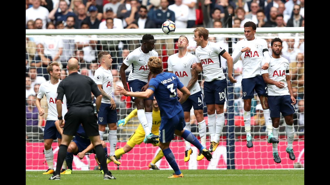 Marcos Alonso whips a free kick over a Tottenham wall, scoring the first goal in Chelsea's 2-1 victory in London on Sunday, August 20. He scored the winning goal as well.
