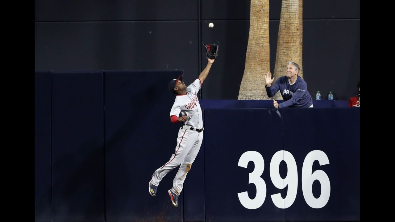 Washington center fielder Michael Taylor makes a catch at the wall during a Major League Baseball game in San Diego on Friday, August 18.