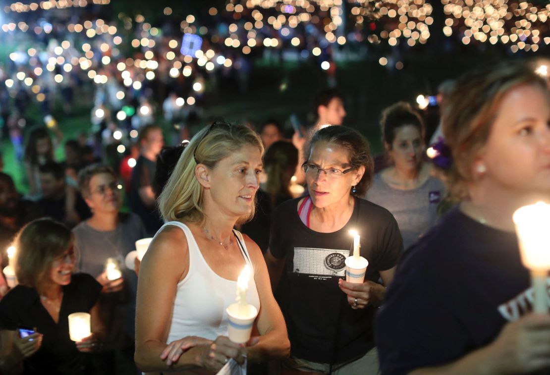 Hundreds of people participate in a candlelight vigil against hate at the University of Virginia on August 16.