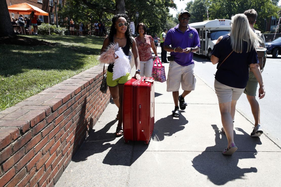 Malia Valentine, 18, of Yorktown, Virginia, and her parents move her into her new dorm at the University of Virginia on Friday.