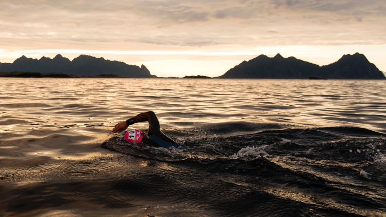 A triathlete swims in Svolvar, Norway, during an Arctic Triple event on Saturday, August 19. The Lofoten Triathlon Extreme started with a swim of about 2.5 miles, and it was followed by a bike ride of nearly 122 miles and a run of 28 miles. <a href="index.php?page=&url=http%3A%2F%2Fwww.cnn.com%2F2017%2F08%2F15%2Fworld%2Fgallery%2Fwhat-a-shot-sports-0815%2Findex.html" target="_blank">See 28 amazing sports photos from last week</a>