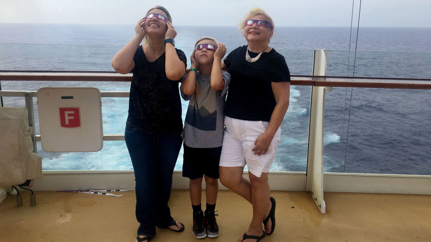 Kathryn Carpenter with her mother and son aboard the Oasis of the Seas for the Total Eclipse Celebration at Sea. 