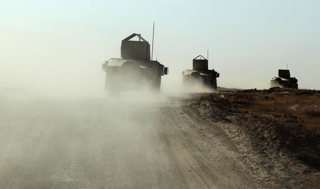 Iraqi forces, backed by Shiite fighters from the Popular Mobilization Forces, advance towards the Iraqi city of Tal Afar 