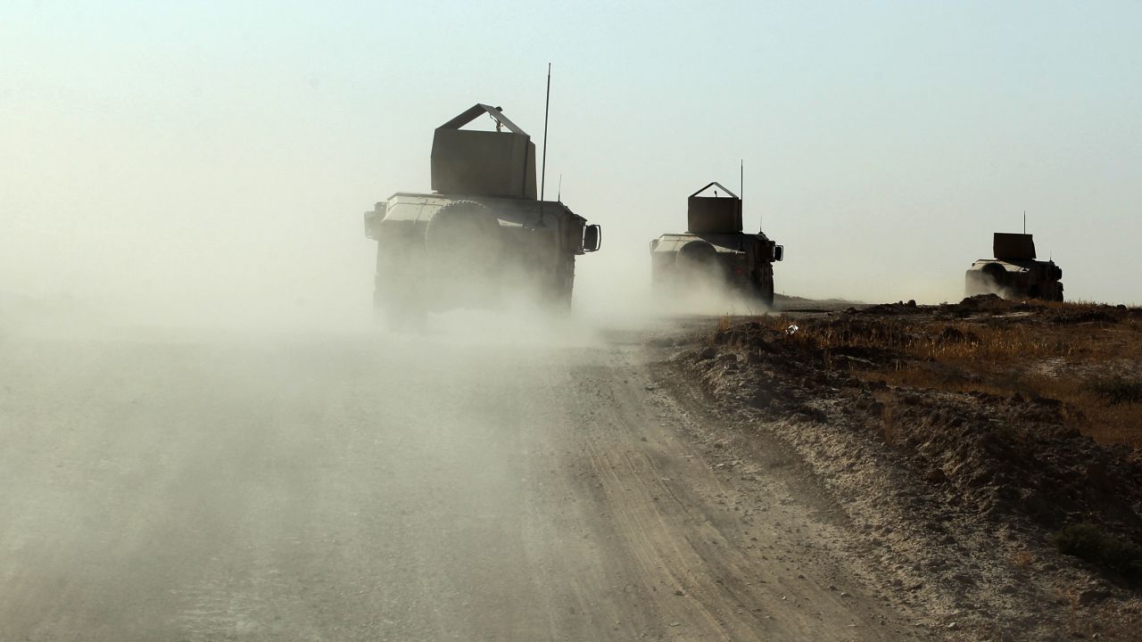Iraqi forces, backed by Shiite fighters from the Popular Mobilization Forces, advance towards the Iraqi city of Tal Afar