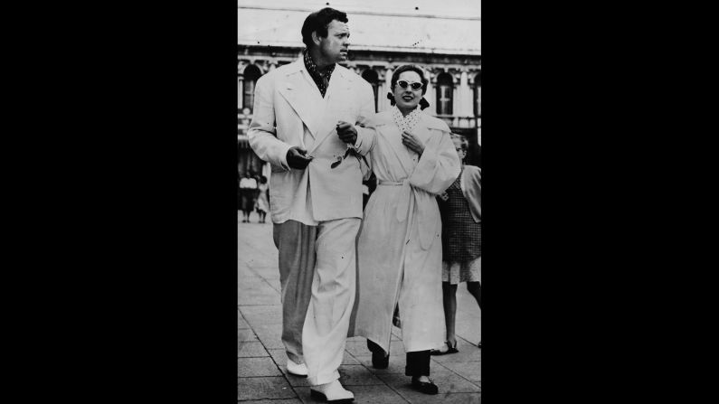 Orson Welles and Italian actress Lea Padovani on a sightseeing tour during the Venice Film Festival.
