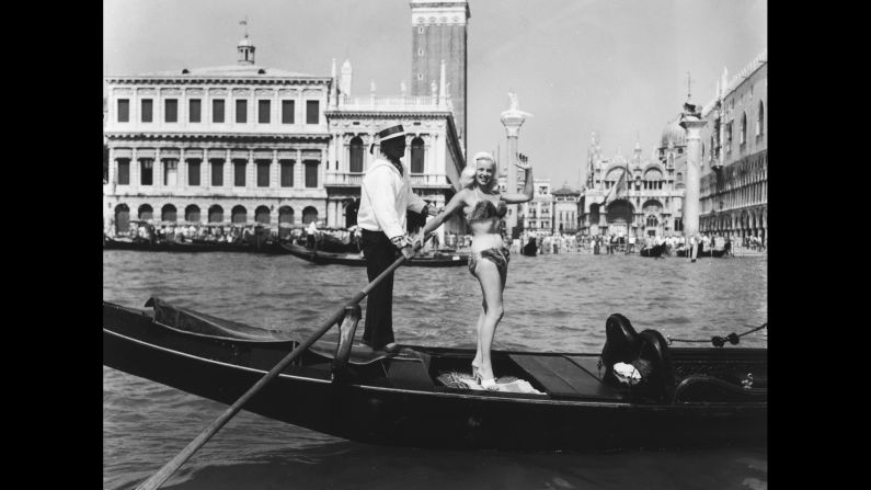 British actress Diana Dors poses in a mink bikini while riding in a gondola in 1955. In true Venice style, the festival's red carpet transcends dry land.