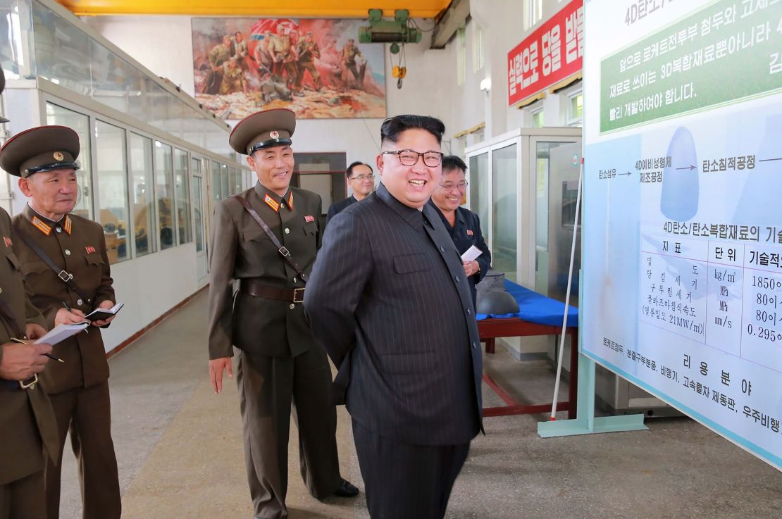 This undated picture released from North Korean state media shows leader Kim Jong Un visiting the Chemical Material Institute of the Academy of Defense Science.