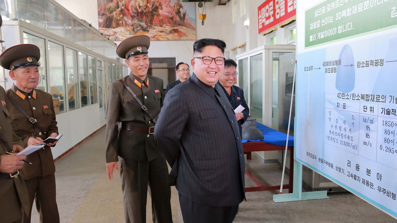 This undated picture released from North Korean state media shows leader Kim Jong Un visiting the Chemical Material Institute of the Academy of Defense Science.
