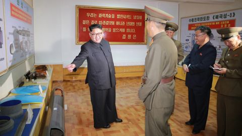 Undated images released by North Korea state media KCNA purport to show leader Kim Jong Un conducting "field guidance" at the Chemical Material Institute of the Academy of Defense Science.