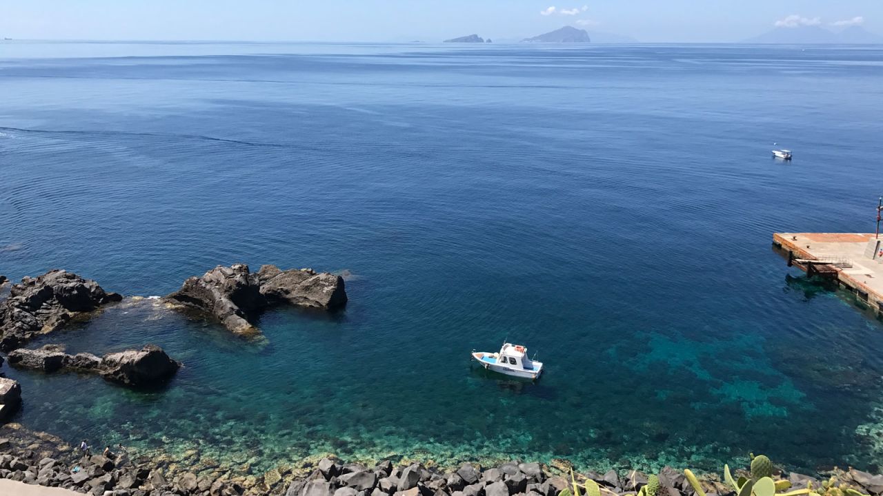 <strong>Stromboli: </strong>The jet-black scenery clashes with the translucent aquamarine water.