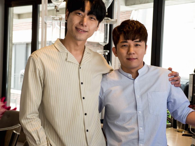 <strong>Friends and partners: </strong>Lee stands with his business partner, Kim Byungho, who also creates cream art coffees at the cafe. "We dreamed together," says Lee. "I started to learn coffee when I was 18 years old. When I was 20, I came to Seoul to attend college. There, I met him and now we have been friends for seven years." 