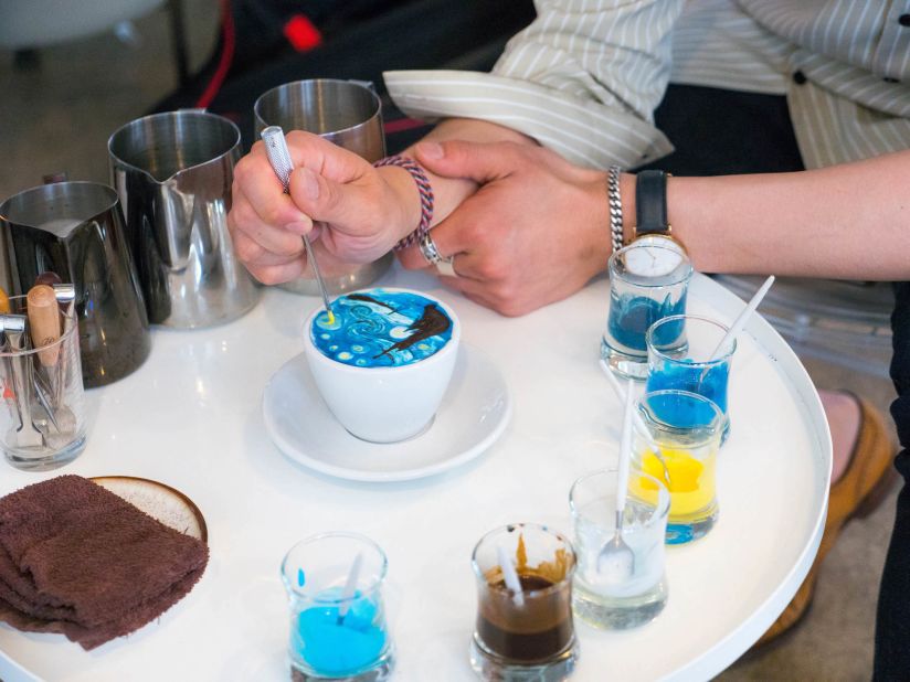 <strong>Master at work:</strong> Lee uses edible icing colors to create his cream art, saying it's important the drinks can actually be consumed. "I only make cream art on cold coffee," he says. "If I make it on hot coffee, the taste changes as it cools off." 