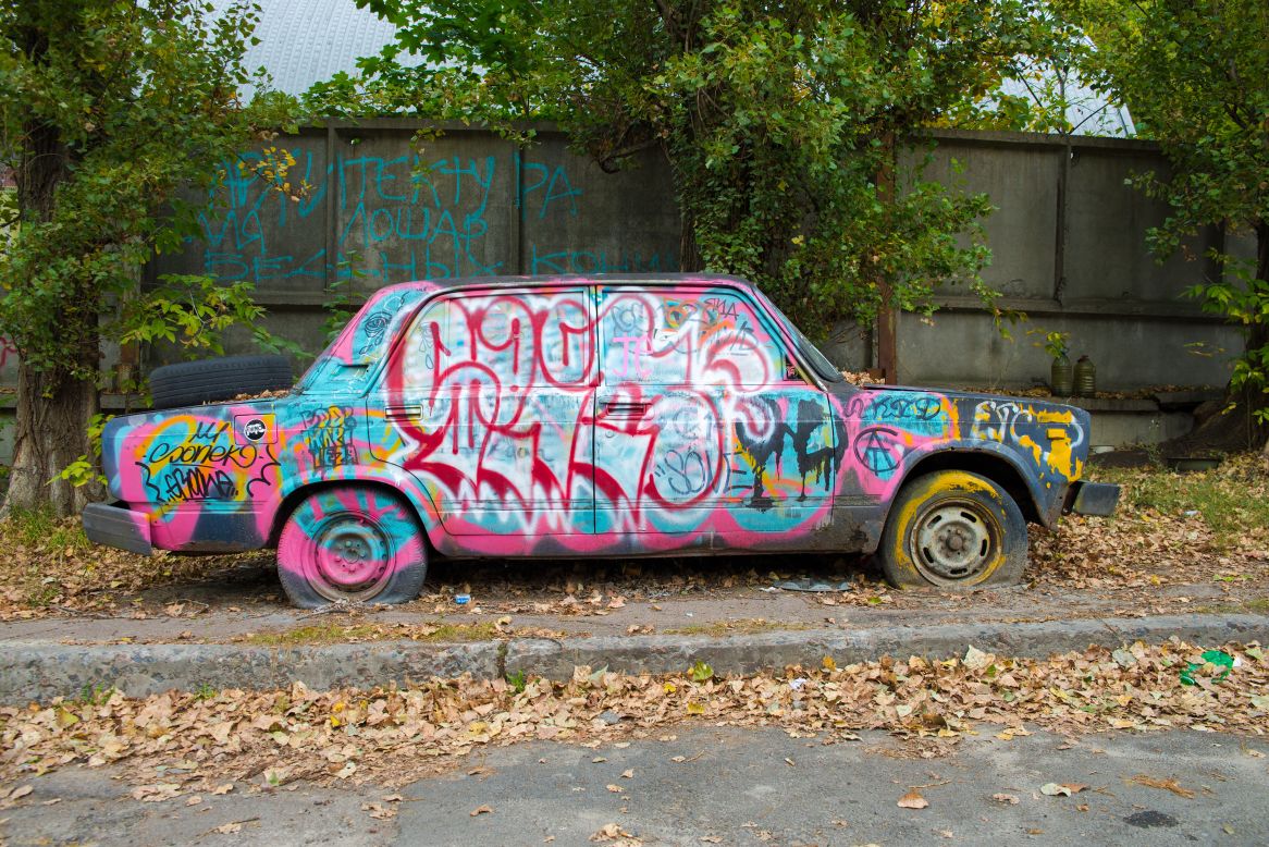 Graffiti artists have transformed this abandoned car in Kiev, Ukraine into a work of art.