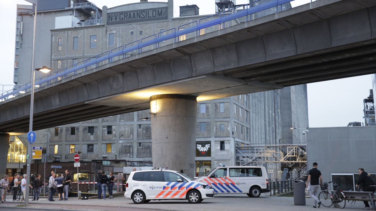 Police are seen outside Rotterdam's Maassilo venue Wednesday after a concert by Californian band Allah-Las was canceled.