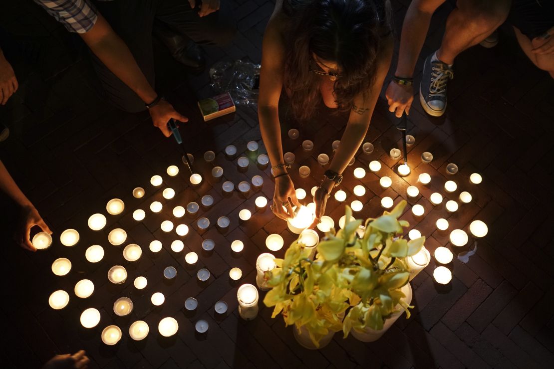 Wall's former classmates attend a vigil at the Columbia University Graduate School of Journalism on Wednesday.