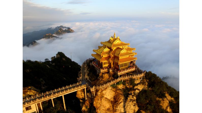 <strong>Henan, China:</strong> The pavilion atop Laojun Mountain towers over the city of Luoyang, when not obscured by clouds. The beautiful limestone peak, connected by cable car, is a popular tourist attraction in the area.