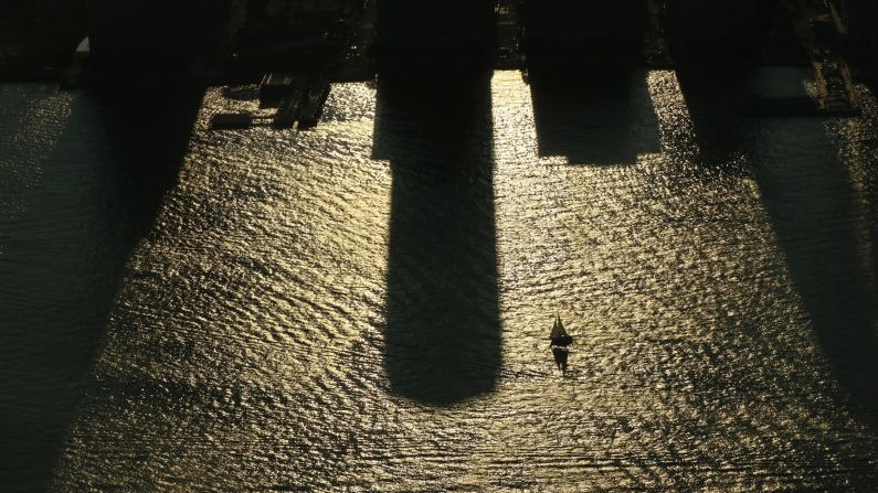 <strong>New York:</strong> <strong> </strong>A sailboat glides across the shadows of buildings in the Hudson River at sunset on August 20, 2017 as the US prepares to witness a solar eclipse. The eclipse was witnessed across the country along apath from Oregon to South Carolina.