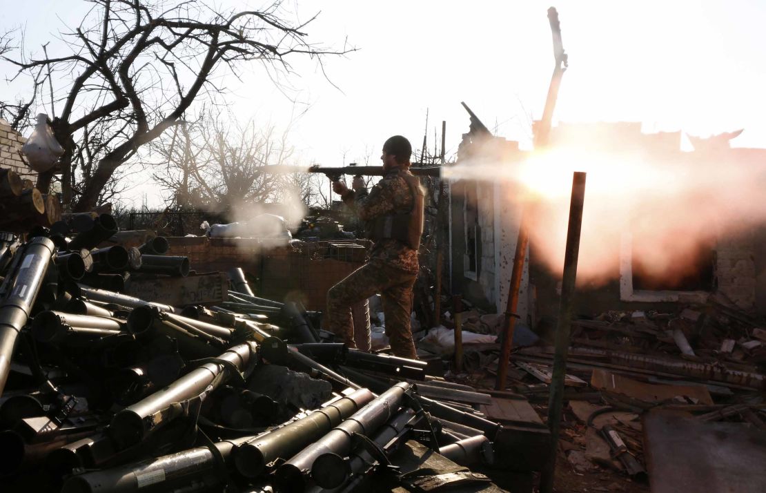 A Ukrainian serviceman shoots with a grenade launcher during fighting with pro-Russian separatists in Donetsk, Ukraine.