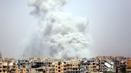 TOPSHOT - Smoke billows out from Raqa following a coalition air strike on July 28, 2017.
The Syrian Democratic Forces, a US-backed Kurdish-Arab alliance, has ousted Islamic State (IS) group jihadists from half of their Syrian bastion Raqa, where the SDF have been fighting for several months to capture the northern city which has become infamous as the Syrian heart of IS's so-called "caliphate." / AFP PHOTO / DELIL SOULEIMAN        (Photo credit should read DELIL SOULEIMAN/AFP/Getty Images)