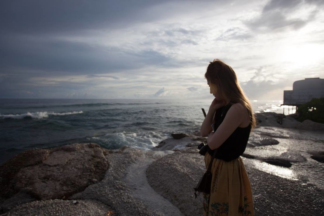 Kim Wall stands on a roadside in Majuro, the capital of the Marshall Islands. Along with reporting partners, she was investigating the impacts of climate change and the legacy of nuclear testing on the Marshall Islands in 2015.