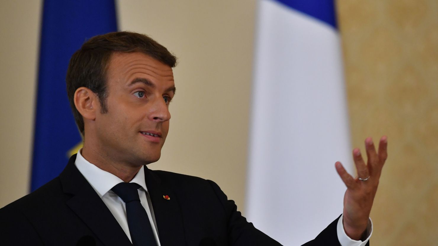 French President Emmanuel Macron speaks at a news conference on August 24.