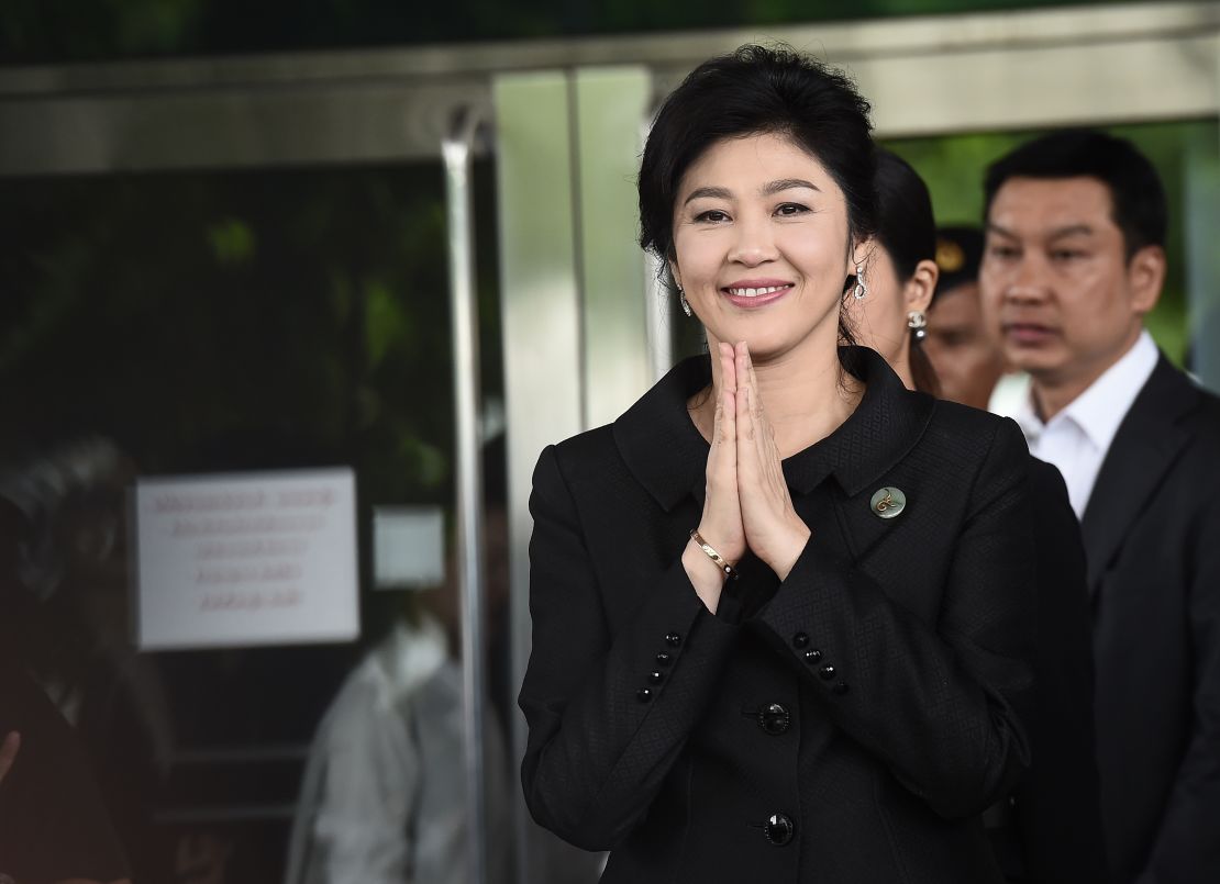 Former Thai prime minister Yingluck Shinawatra greets her supporters in Bangkok on July 21, 2017.
 