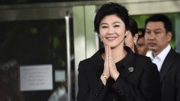 Former Thai prime minister Yingluck Shinawatra greets her supporters as she leaves the Supreme Court in Bangkok on July 21, 2017.
Toppled Thai premier Yingluck Shinawatra was mobbed on July 21 by well-wishers, many bearing red roses, as she arrived for what could be the final hearing of a trial for criminal negligence that carries a 10-year jail term. / AFP PHOTO / LILLIAN SUWANRUMPHA        (Photo credit should read LILLIAN SUWANRUMPHA/AFP/Getty Images)